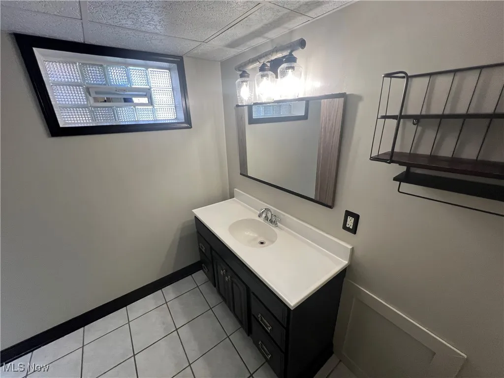 Basement Bathroom with shower / bathtub combination with curtain