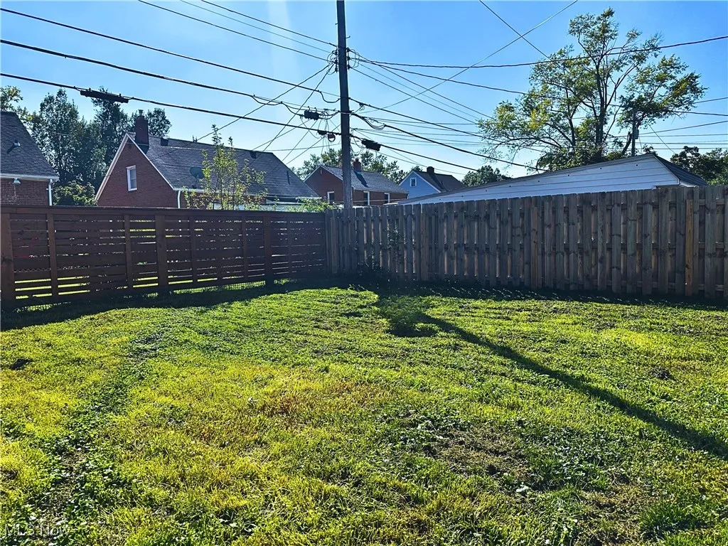 View of fenced backyard