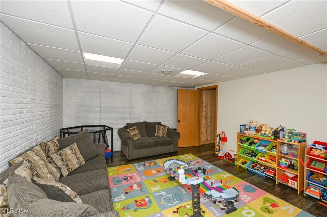 Playroom/Game room with a half bath