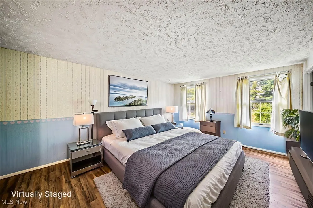 Virtually staged primary bedroom, large closet with full bathroom.