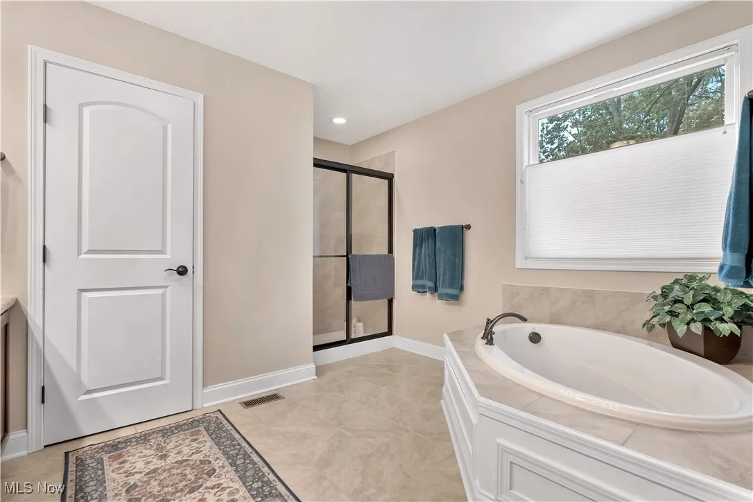 Includes tile shower and large soaking tub