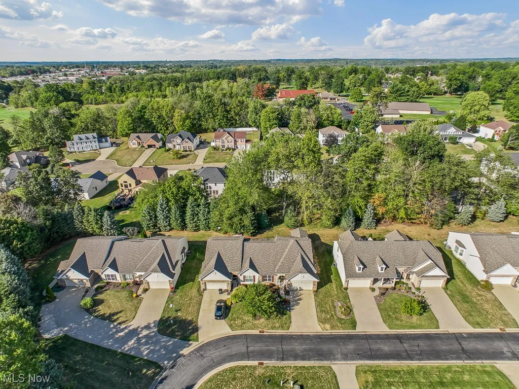Aerial view of property's location with nearby suburban area