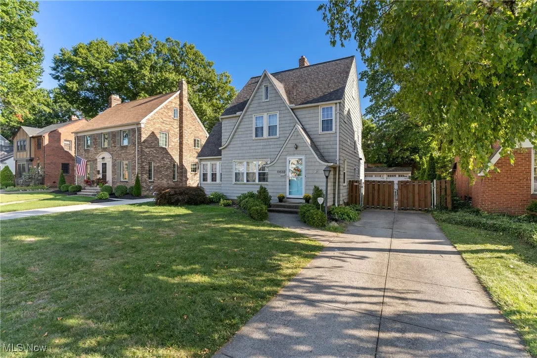 View of front of home with a shingled roof