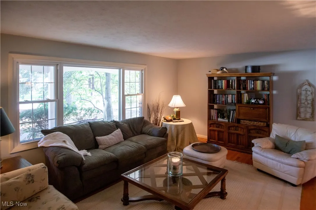 Living room area featuring wood finished floors