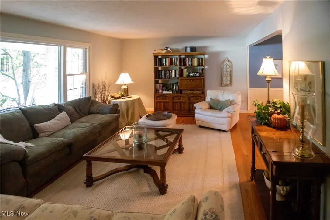 Living room area featuring wood finished floors