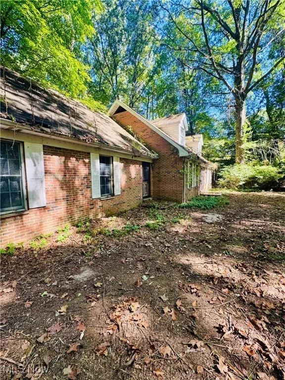 View of home's exterior with brick siding