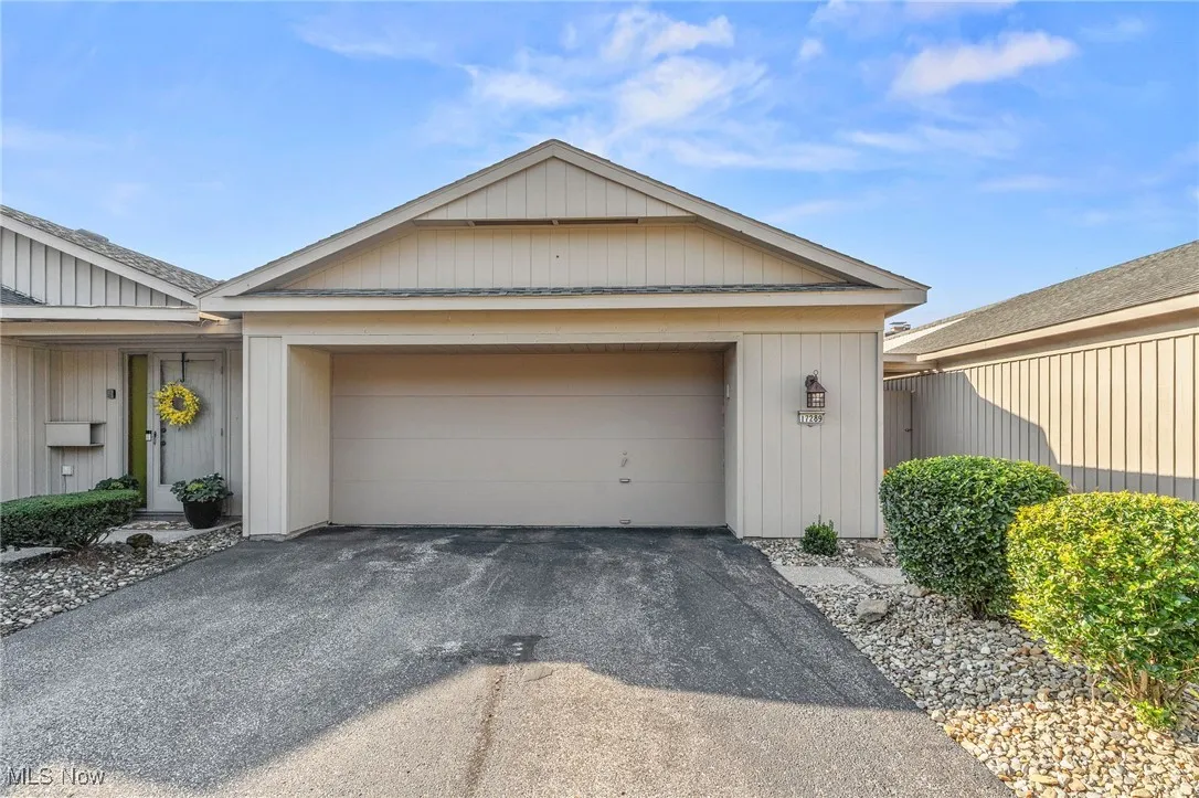 View of front of property featuring driveway and a garage