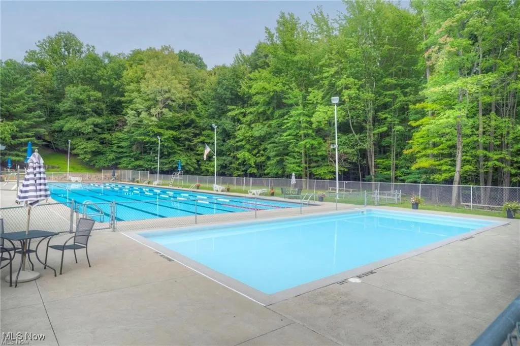 Community pool featuring a patio area