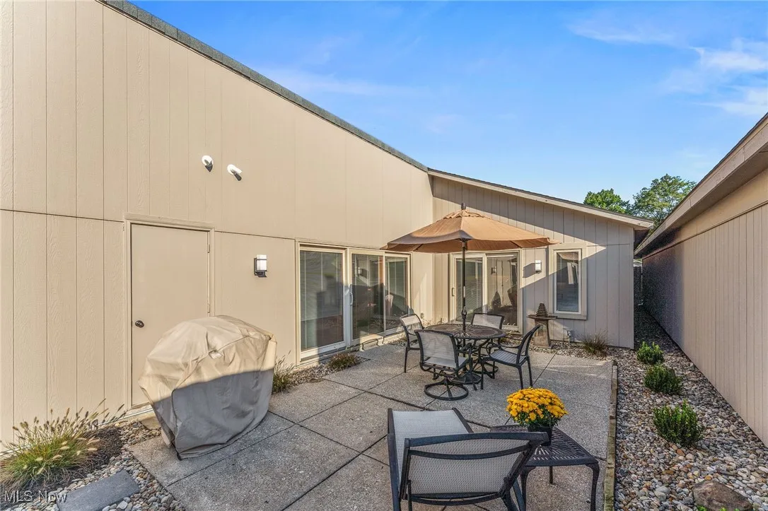 View of patio / terrace with a grill and outdoor dining area