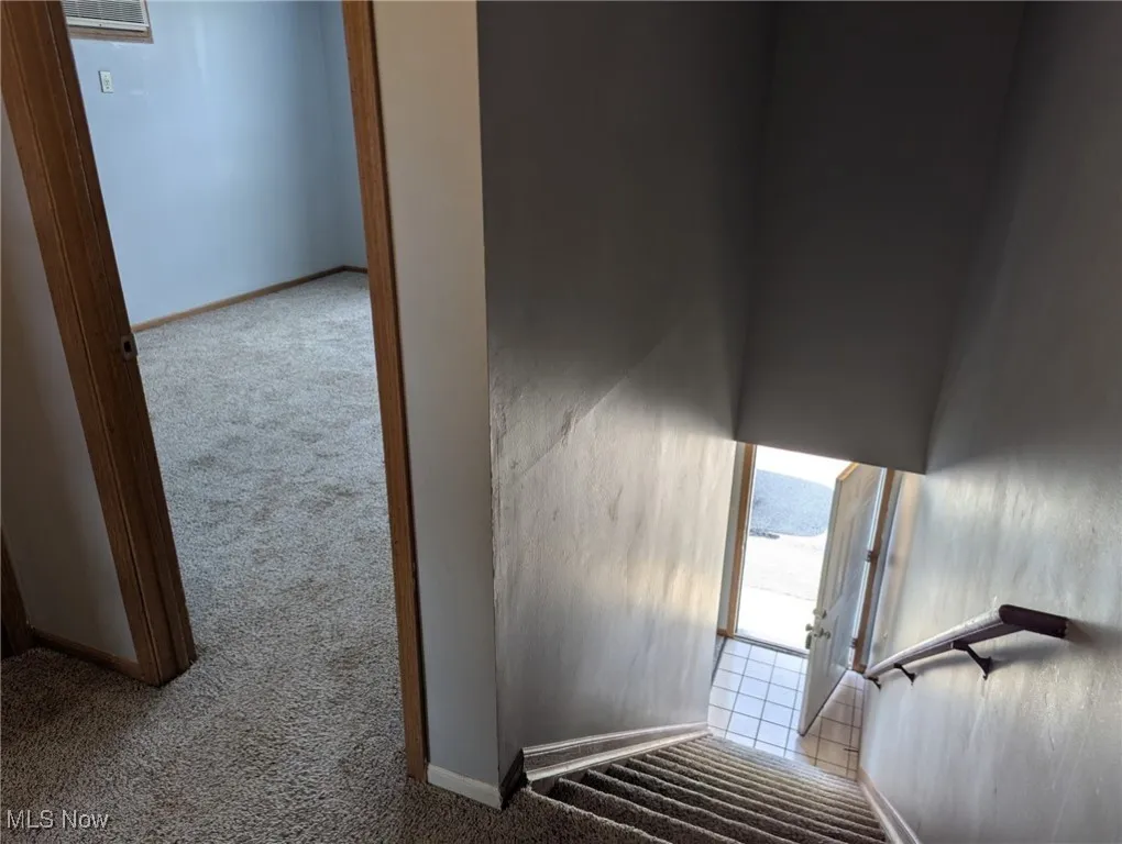 Stairway featuring carpet