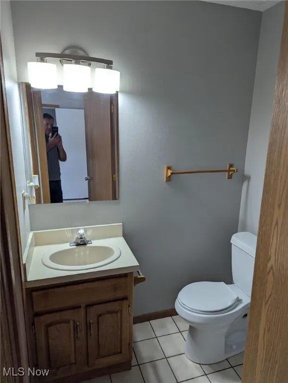 Bathroom featuring light tile patterned floors and vanity