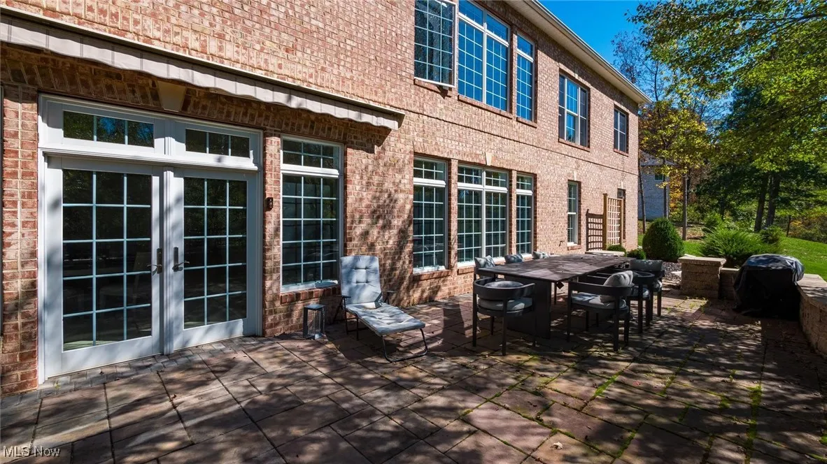 View of patio with outdoor dining space and french doors