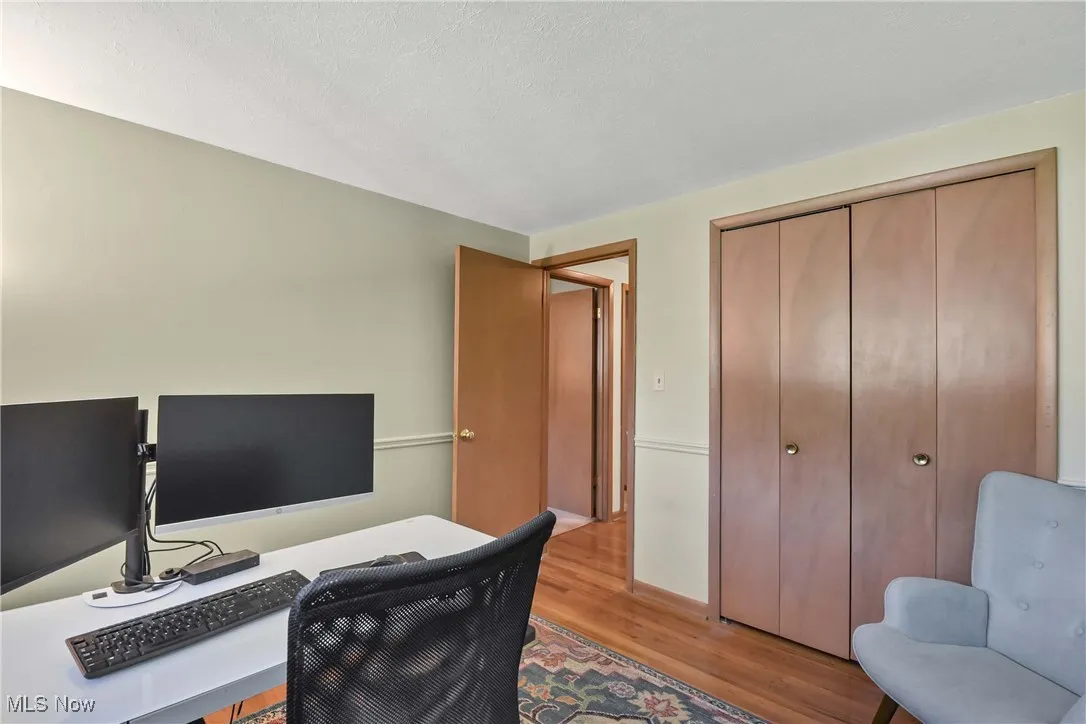 Office with wood finished floors