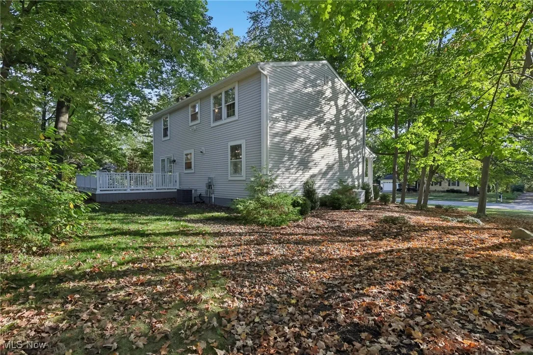 Back of house with a deck
