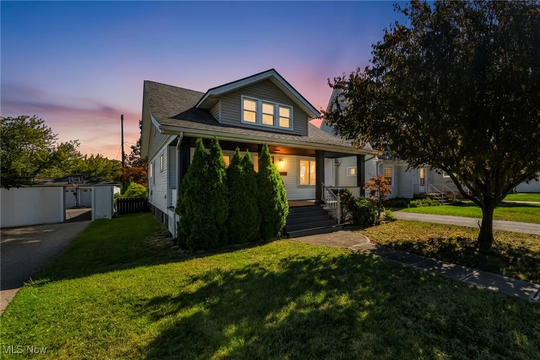 Bungalow-style house featuring a porch and roof with shingles