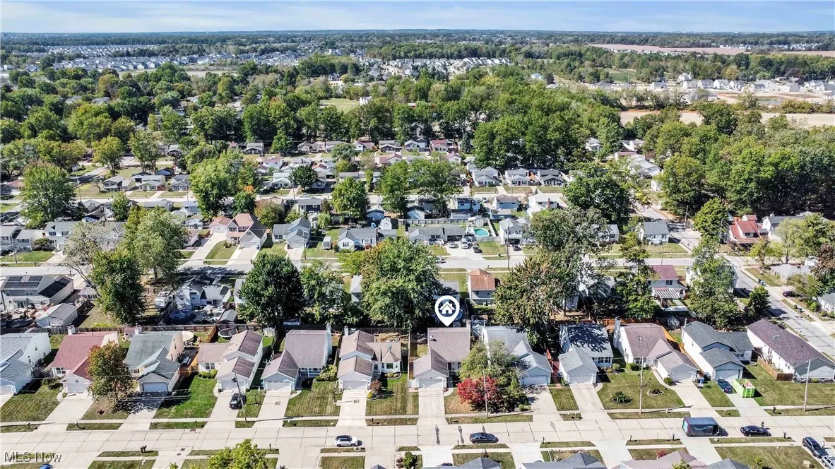Aerial view of property's location featuring nearby suburban area