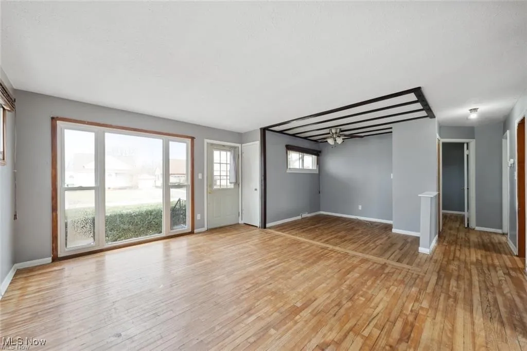 Empty room featuring light wood-style flooring and baseboards