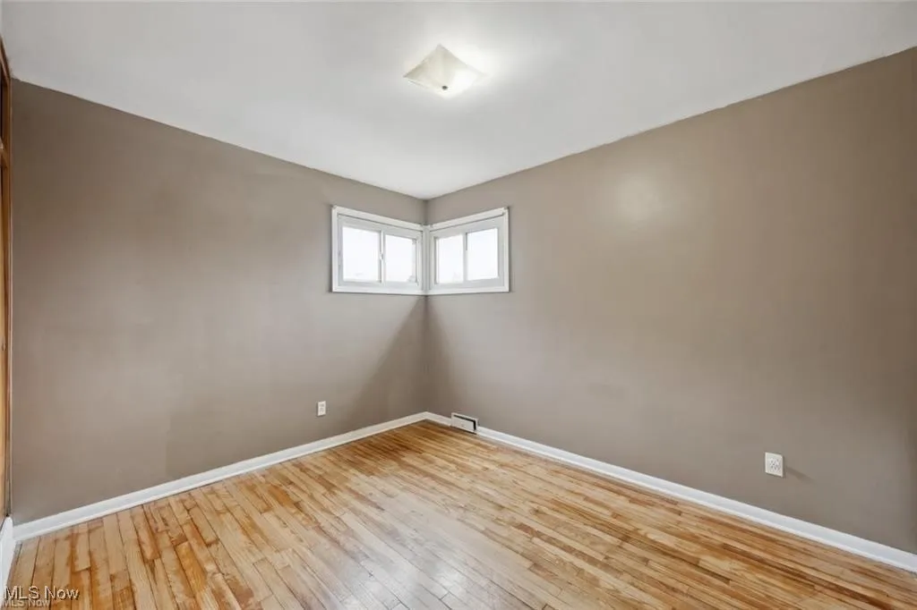 Empty room featuring light wood-style floors and baseboards