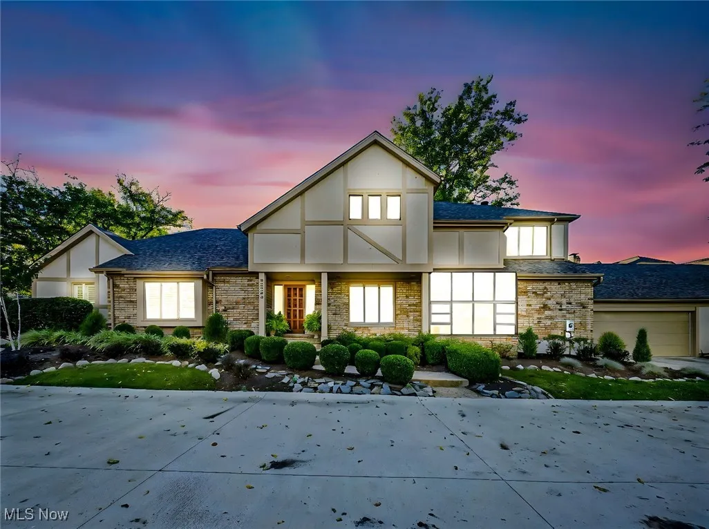 View of front of home with stone siding and stucco siding