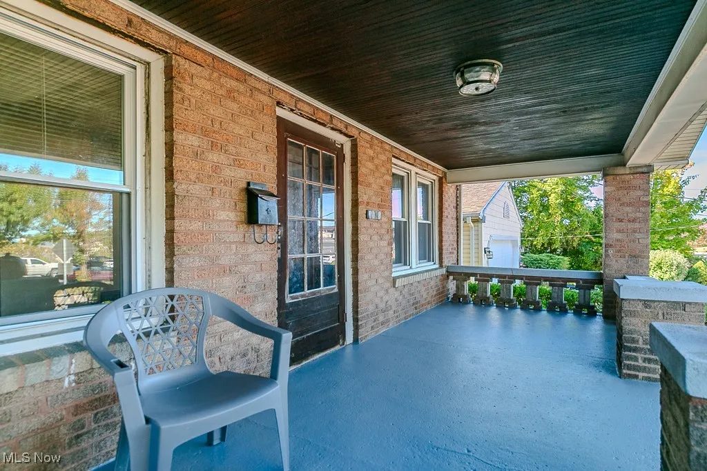 Porch featuring area for grilling