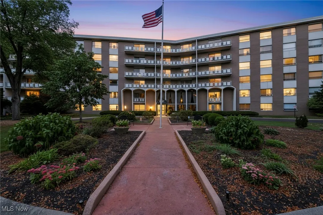 View of property at dusk