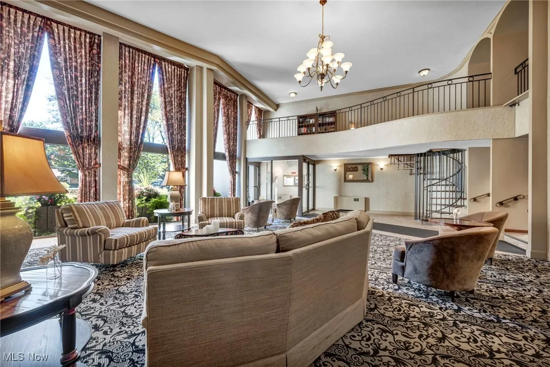 Community lobby with a towering ceiling and stairs