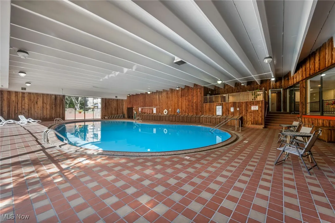 Indoor pool with a patio area