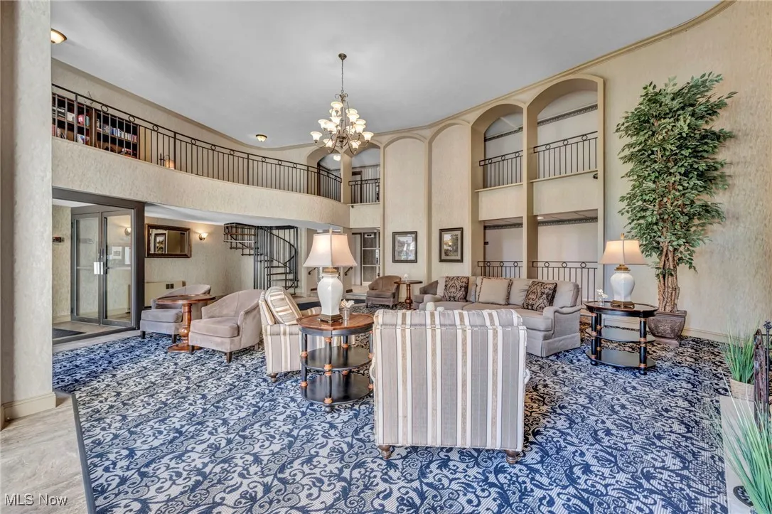 Common area with a high ceiling and stairway