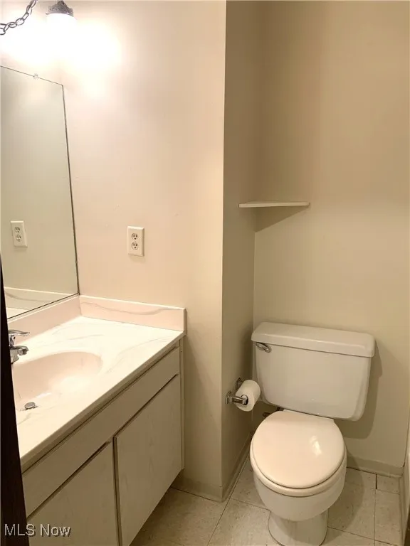 Bathroom featuring vanity and light tile patterned floors