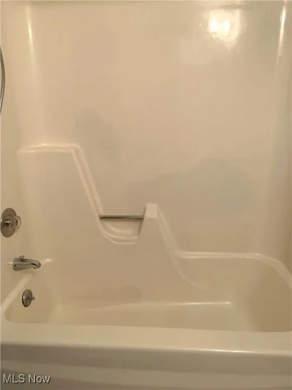 Full bath featuring shower / bathtub combination