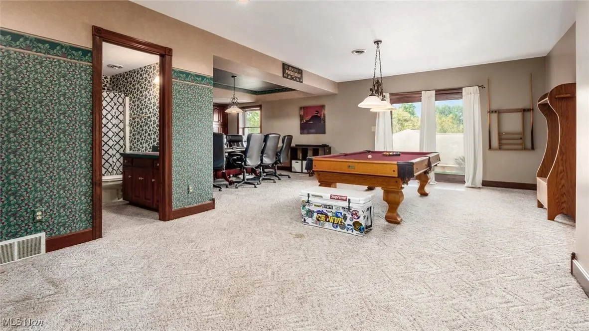 Game room with carpet, wallpapered walls, and pool table
