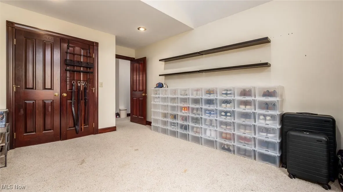 Living area with carpet and recessed lighting