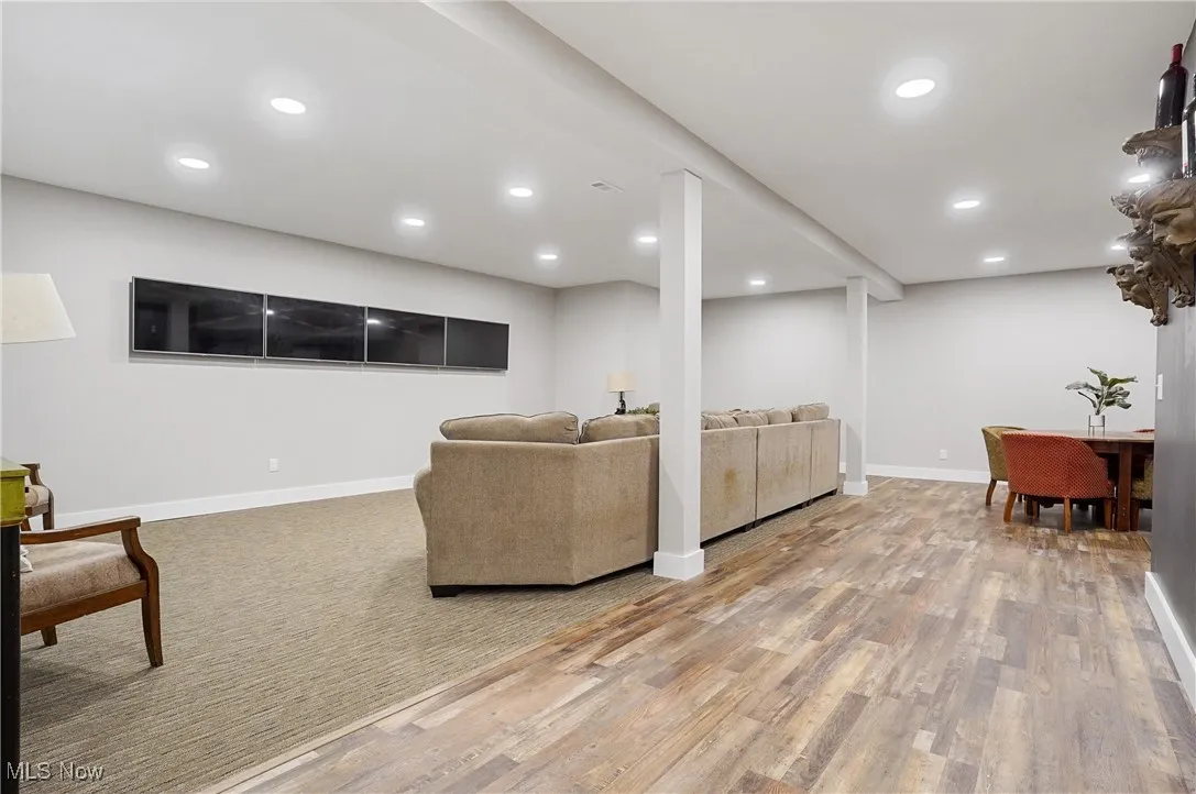 Living area featuring recessed lighting and light wood-style flooring