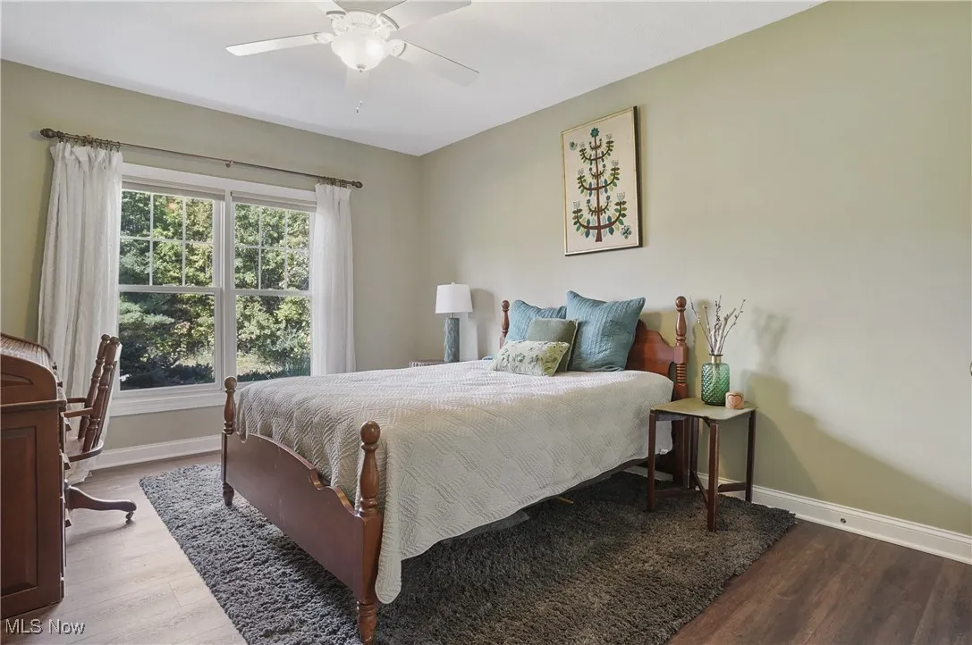 Bedroom with wood finished floors and ceiling fan