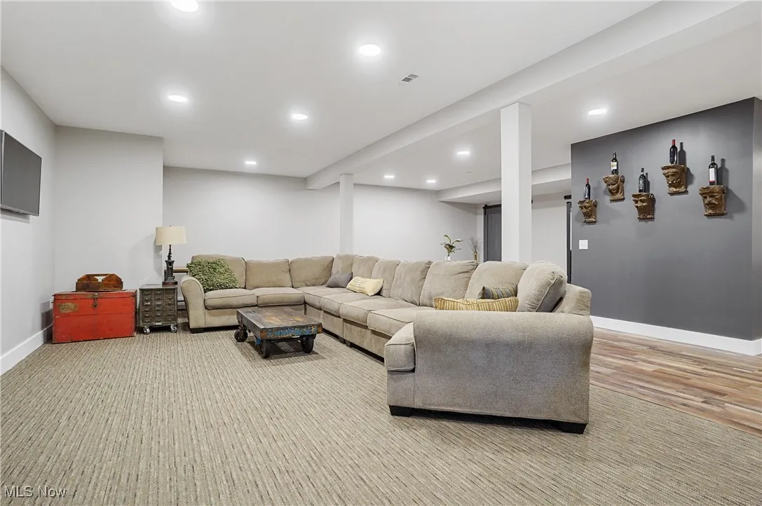 Living area featuring recessed lighting and light wood finished floors