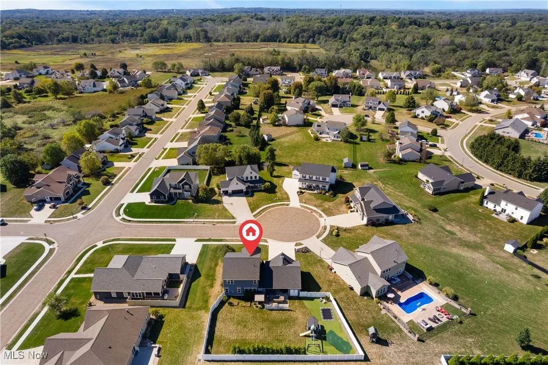 Aerial overview of property's location featuring nearby suburban area