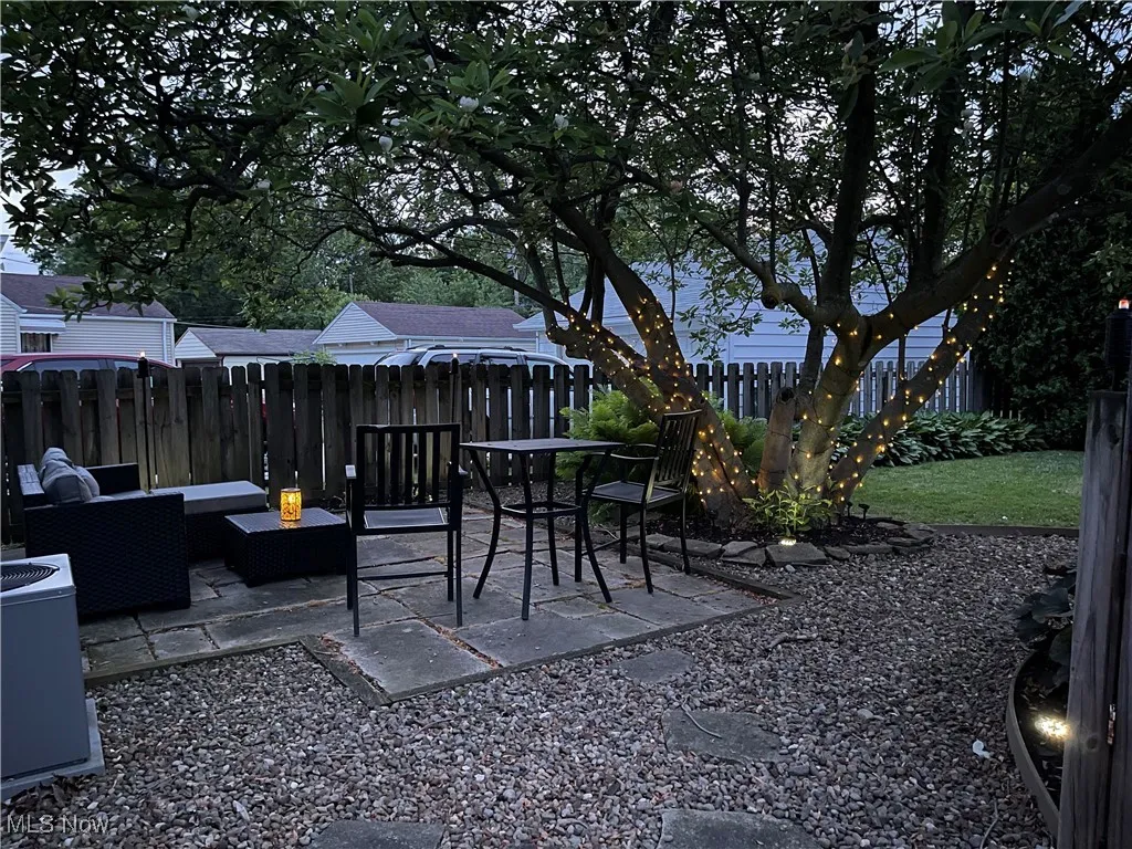 Fenced backyard featuring a patio area and outdoor lounge area