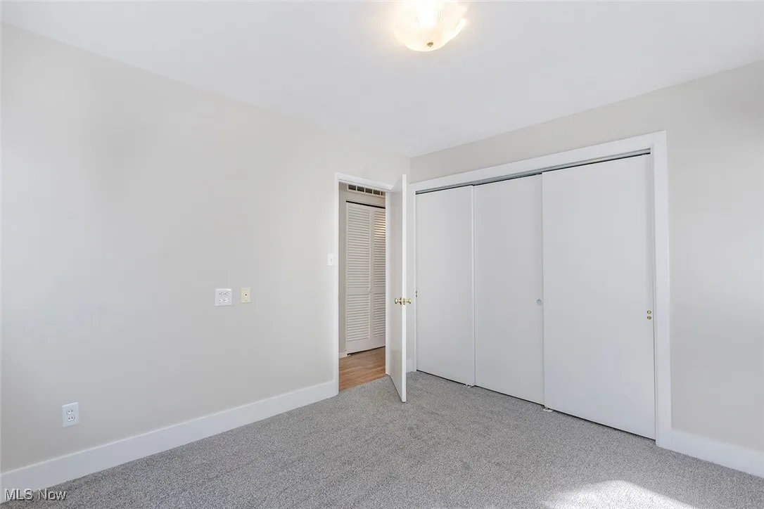  Bedroom with carpet and a closet