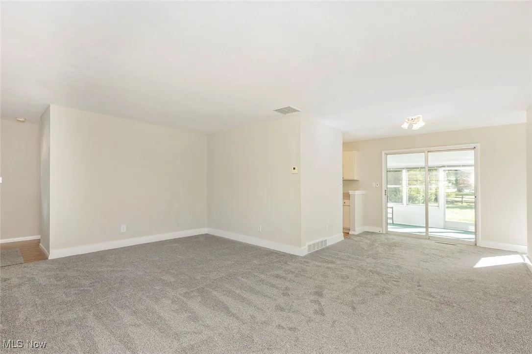 Living & dining rooms, sliding doors to enclosed porch.