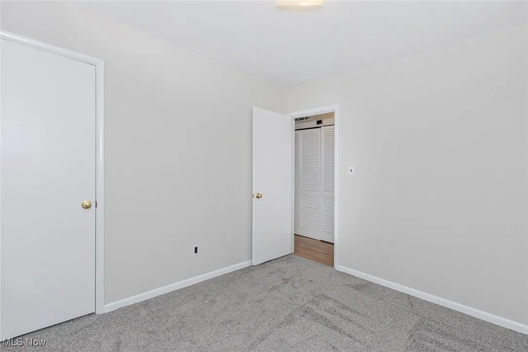  Bedroom featuring baseboards and carpet flooring