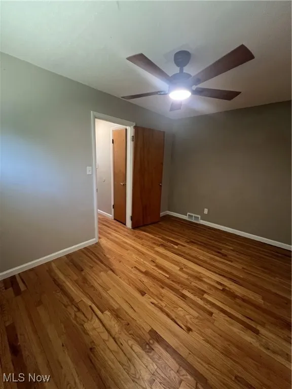 Unfurnished bedroom featuring light wood finished floors and a ceiling fan