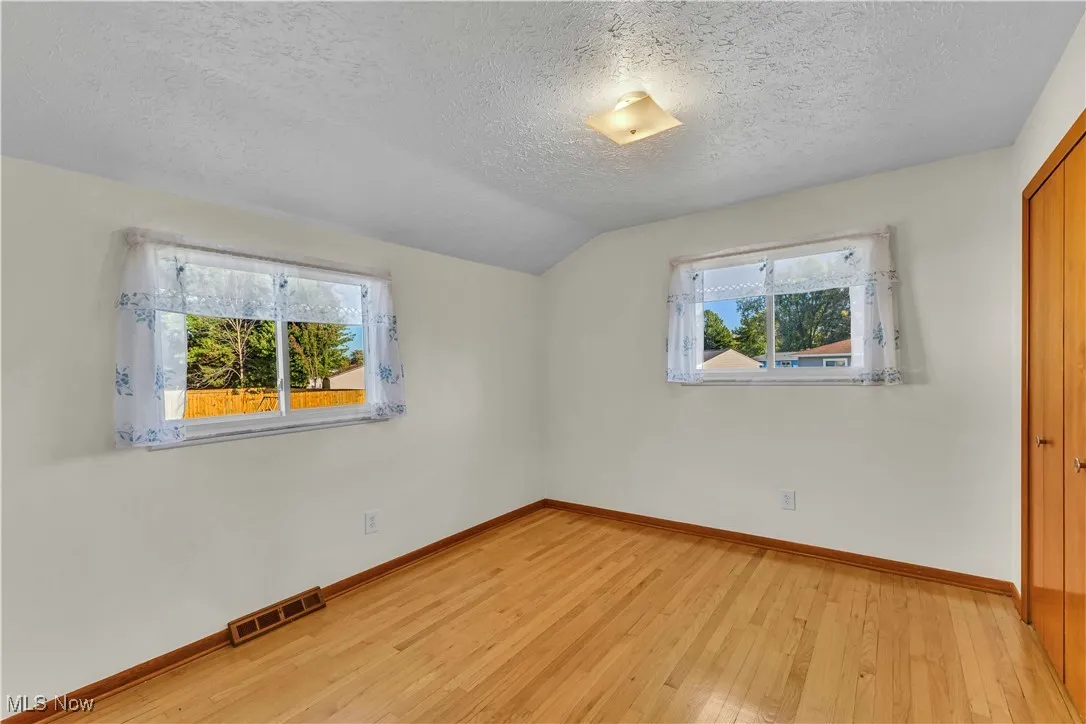 Second bedroom with hardwood floors