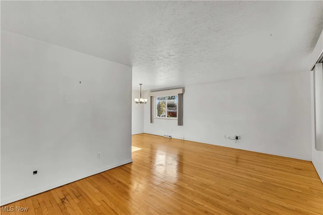 Living room view from entryway with hardwood flooring