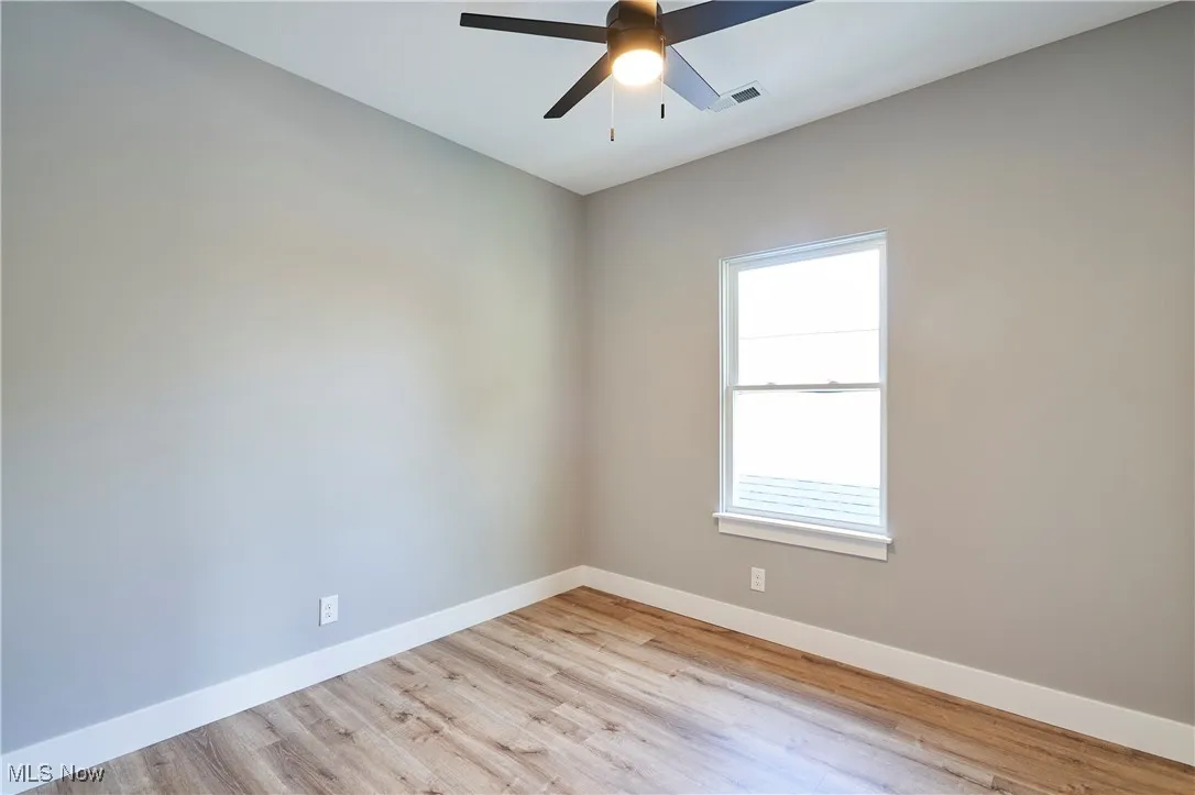 Spare room featuring light hardwood / wood-style flooring and ceiling fan