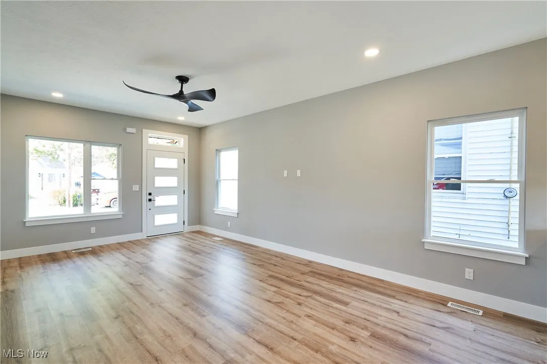 Spare room with ceiling fan and light hardwood / wood-style flooring