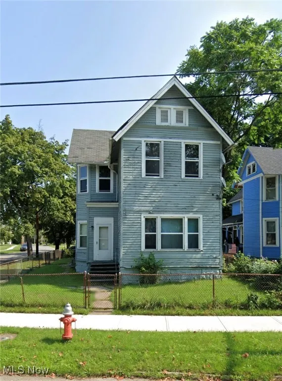 View of front of property featuring a gate and a fenced front yard