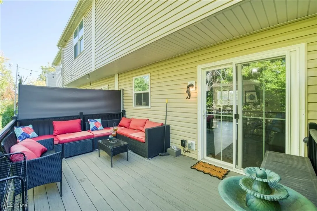 Wooden terrace featuring outdoor lounge area