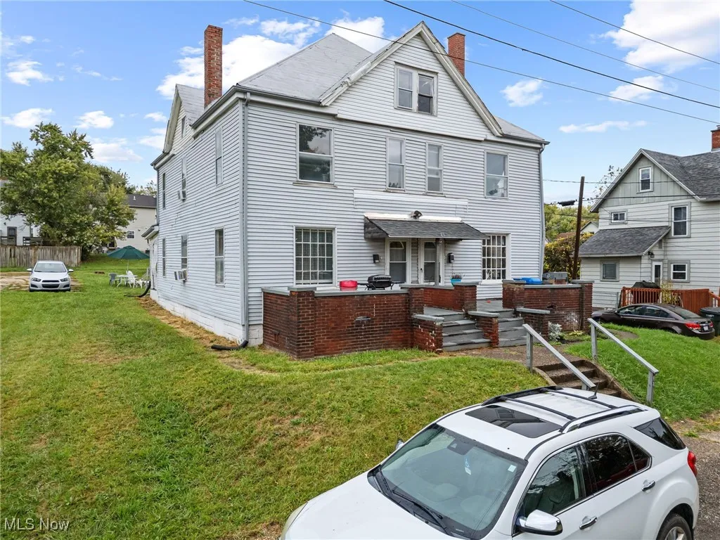 View of front of house with a chimney