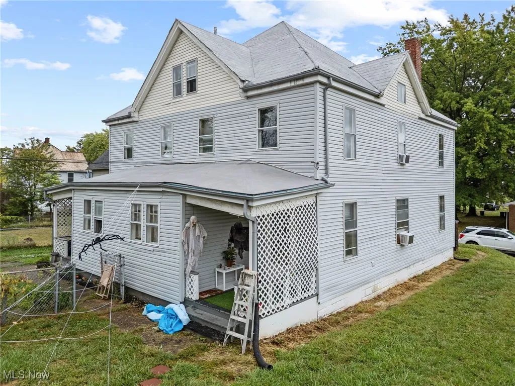View of home's exterior featuring a chimney