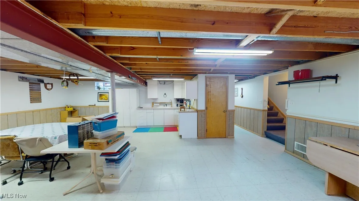 basement showcasing kitchenette.